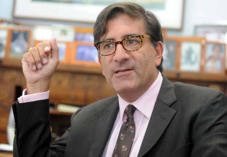 bazosheadshot Headshot of Dr. Andrew Bazos while he is speaking.